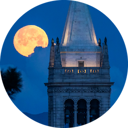 Campanile with moon behind.